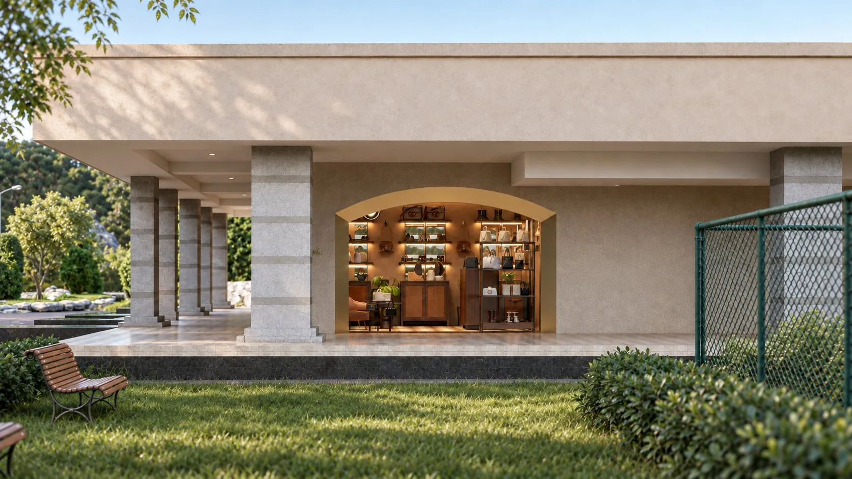 The store seen from the lawn, arched opening set into a pale rendered wall