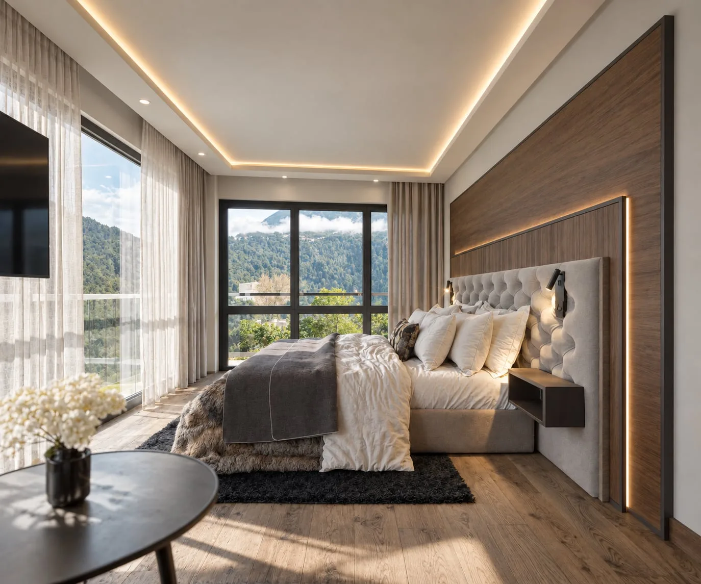 A bed with a buttoned headboard against a timber-panelled wall, black-framed window beside it and snow on the peaks beyond
