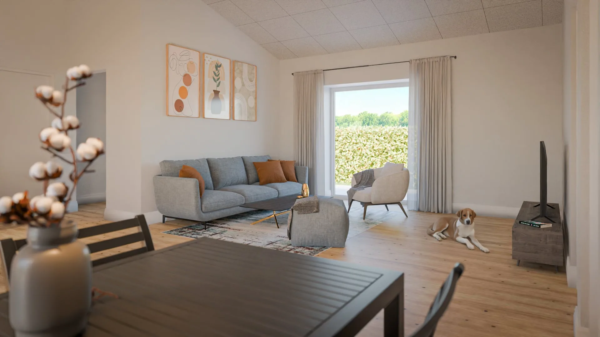 Living room with a grey sofa, armchair and wood burner, a dog asleep by the table